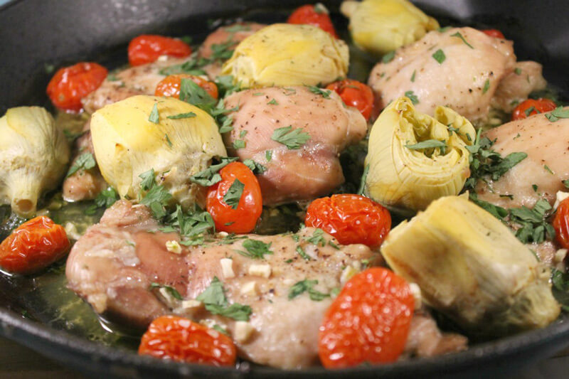 This tomato & artichoke chicken dinner has only 5 ingredients and took about 2 minutes to assemble and throw in the oven. Plus, you can cook the entire thing in a cast iron pan!