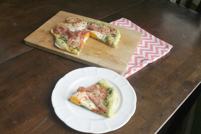 Paleo Breakfast Pizza with paleo pizza crust made from tapioca flour served on a rustic table