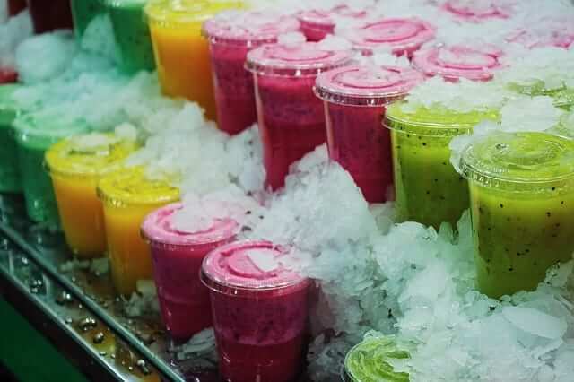 a display of commercial fruit smoothies on ice 