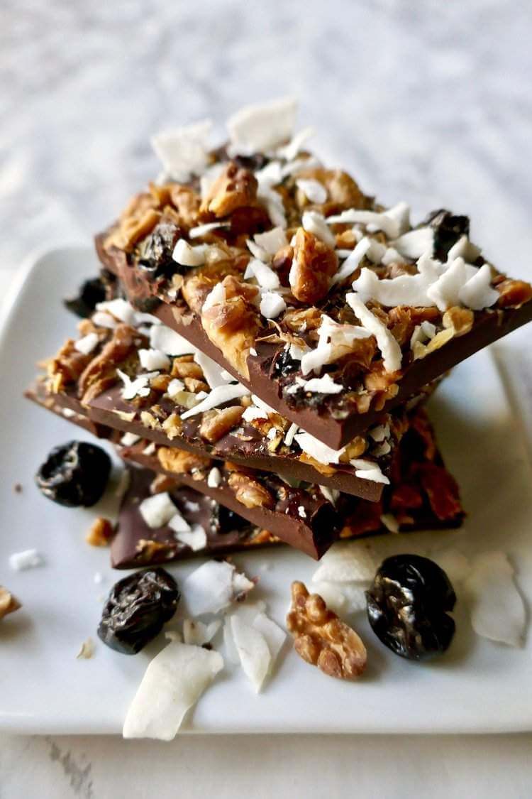 Paleo Chocolate cherry nut bark stacked on top of each other