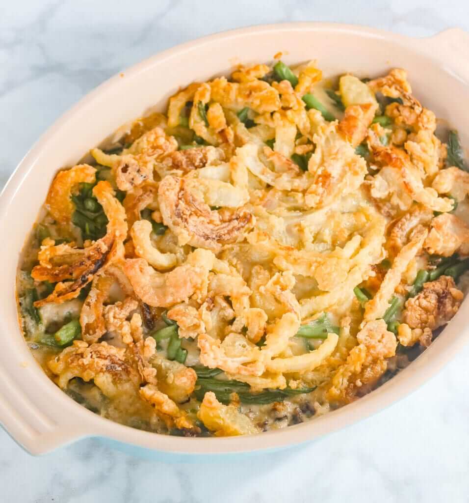 overhead shot of a healthy green bean casserole with gluten-free crispy onion topping 