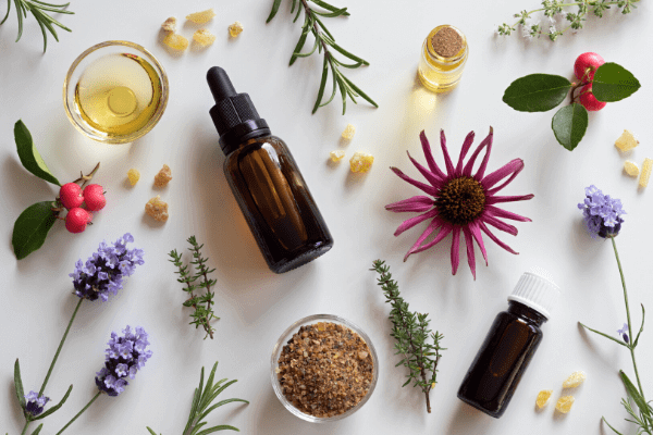 different immune boosting herbs and oils gathered on a kitchen counter 