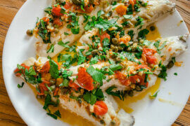 SEA BASS with tomatoes and capers